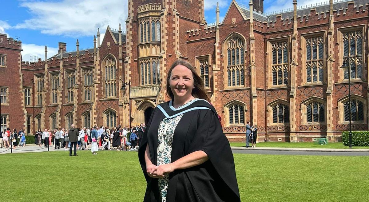 Suzy Agnew standing in front of Queens University Belfast.